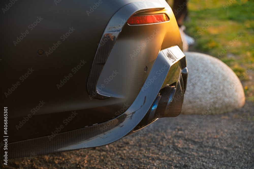 Spitting exhaust fumes and splashing water from the exhaust, the classic sports car