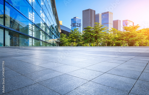 Empty square floor and glass wall with modern office buildings in Shenzhen