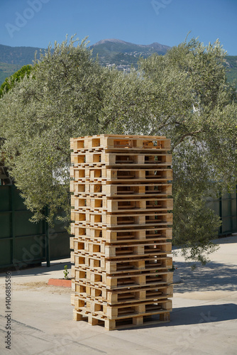 Obraz na płótnie Large pile of wooden pallets outdoors at the factory loading dock. w salonie