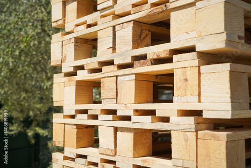 Obraz na płótnie Stacked Wooden Pallets in an Outdoor Environment Highlighting Natural Textures w salonie