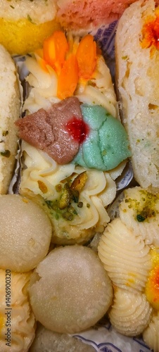 a colorful assortment of traditional Indian sweets,