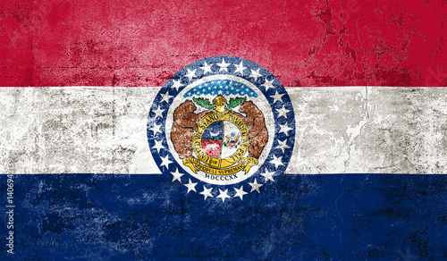 Missouri State Flag. Dirty Missouri state flag on the wall.