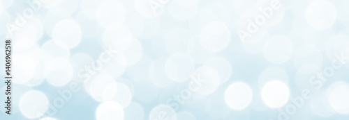 Abstract background with blurred white and light blue bokeh lights. Luxurious background with stunning bokeh light, Design for both web and print display background.