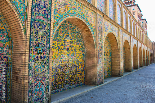 mosaic facade, decorative arch design, Persian tile arch, Colorful arches of Golestan Palace​, Mosaic patterns facade, Traditional Iranian arch design, Historical arch designs of Iran