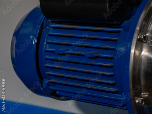 A blue motor with a silver casing