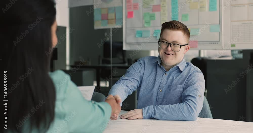 Positive down syndrome business professional man getting job in inclusive company, giving handshake over table to recruit manager after interview meeting, smiling