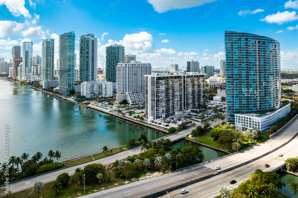 Fototapeta premium Miami, Florida - Feb 25, 2025: Aerial view of Edgewater waterfront high-rises in Miami, Florida, with scenic Biscayne Bay and modern residential towers.