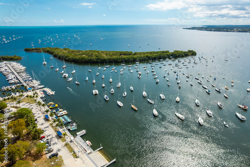 Coconut Grove, Miami, Florida - Feb 27, 2025: Aerial view of Dinner Key Picnic Islands Park and sailboats in Biscayne Bay photo
