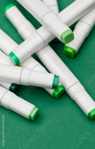 Several markers on a green background