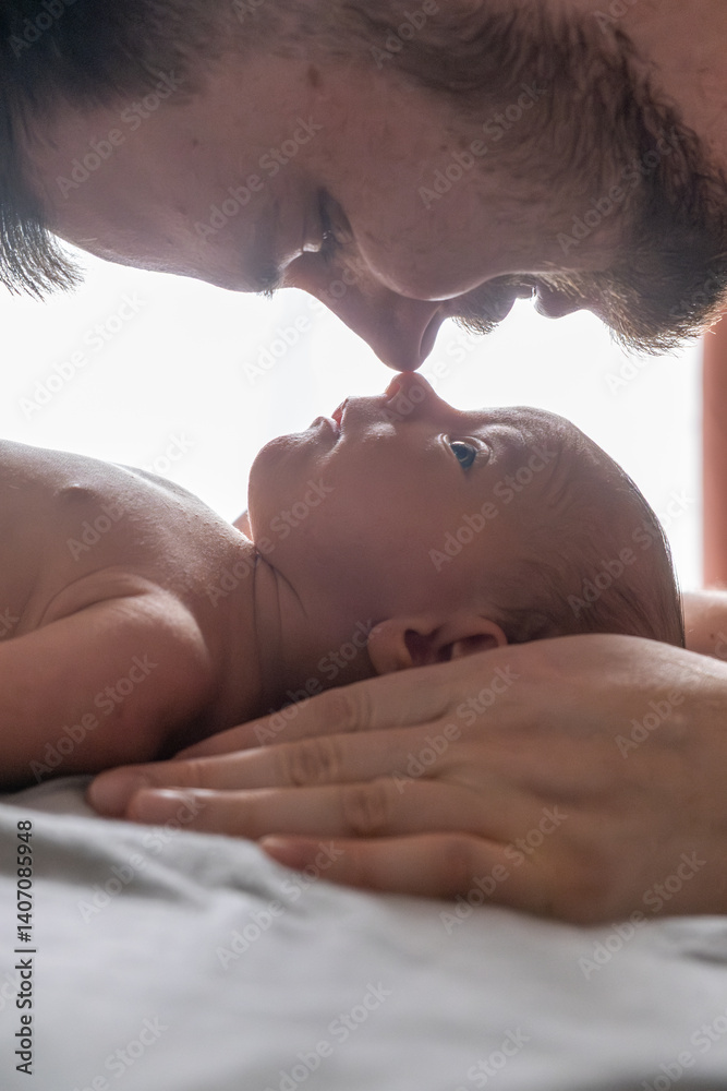 Father and Newborn Sharing a Tender Moment