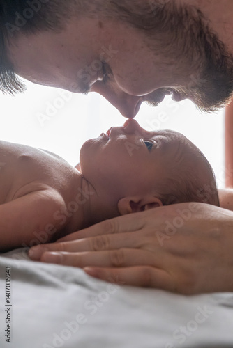 Obraz na płótnie Father and Newborn Sharing a Tender Moment w salonie