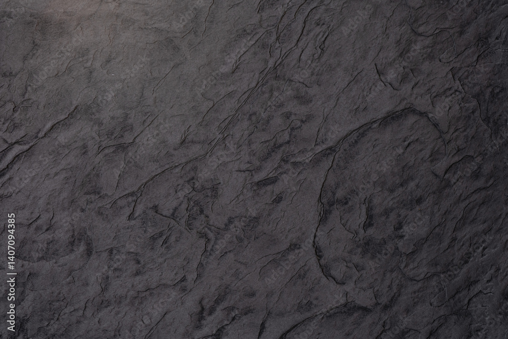 Naklejka premium Dark textured surface showcasing natural stone-like patterns and shades
