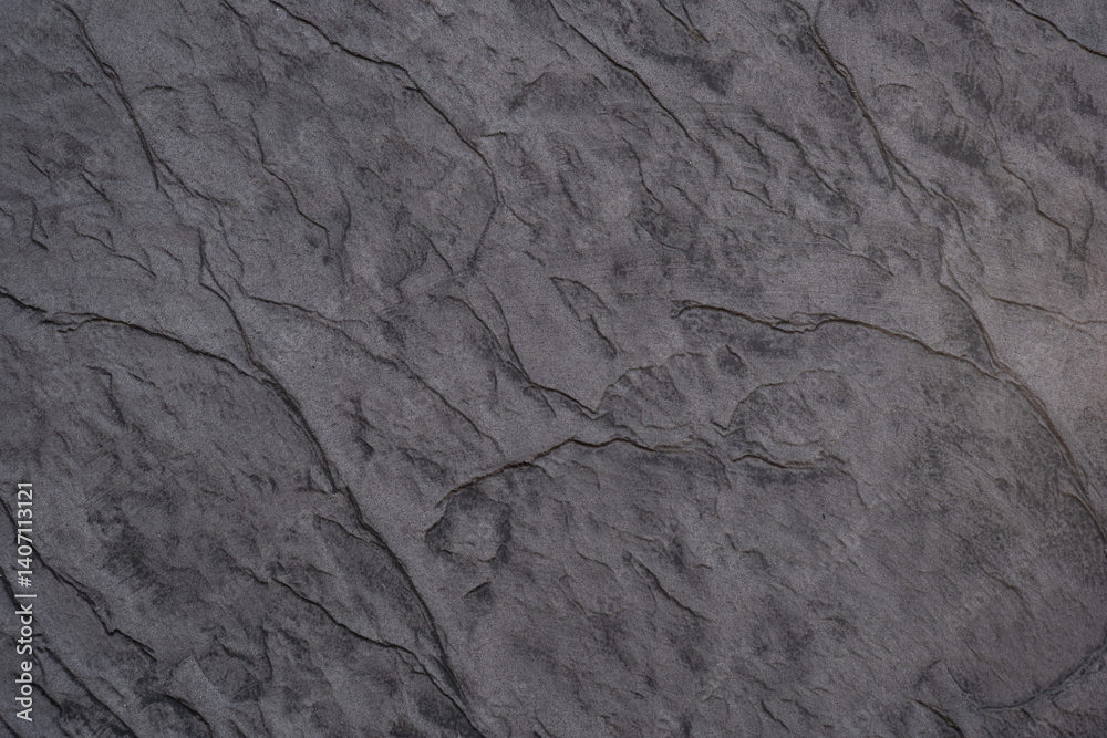 Naklejka premium Detailed texture of weathered stone surface with distinct lines and patterns