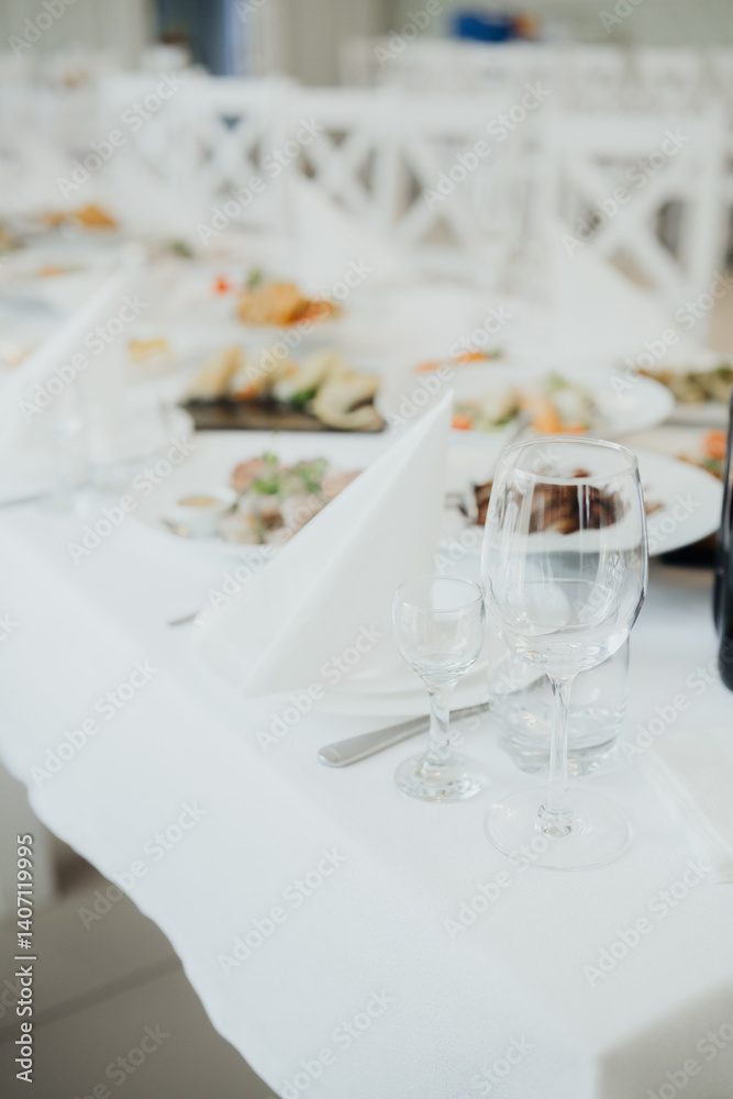 Fototapeta premium Elegant dining table set for a special event with gourmet cuisine and decor