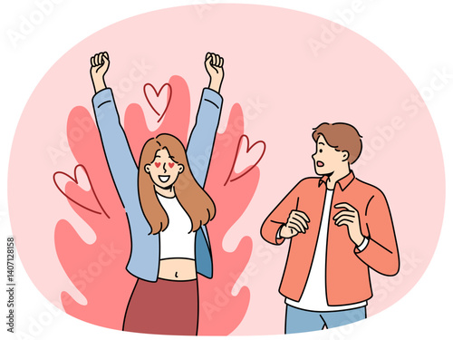 Excited woman is in love with man who is scared because of excessive passion from fan. Guy looks excitedly at girlfriend feeling great passion and sympathy for boyfriend or fiance.