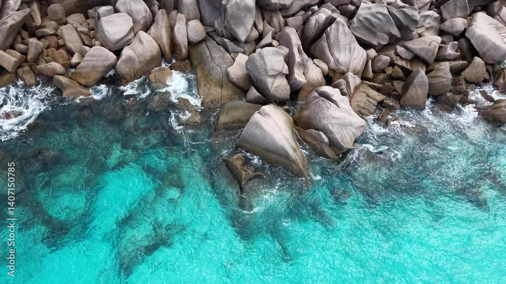La Digue, Seychelles – iconic granite rock formations rising from the turquoise sea, showcasing the island’s unique and dramatic coastal landscape.
