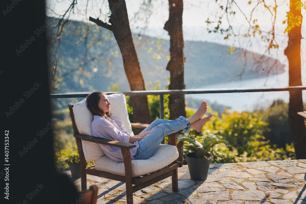 Young woman enjoying nature view from terrace