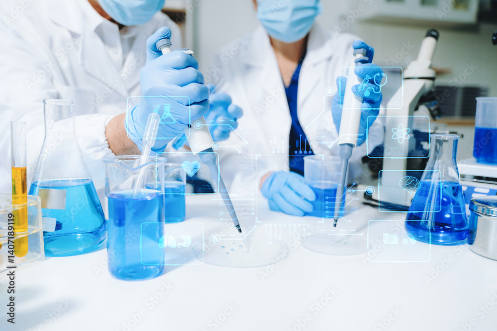 Fototapeta premium Two Asian female scientists conduct biochemical research using micro pipettes in a high-tech medical lab