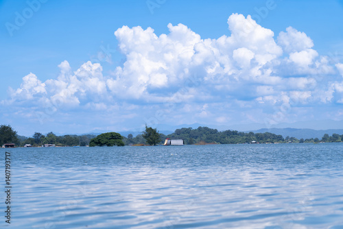 Bright morning lake with cloudy sky