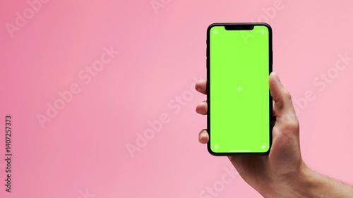 Unrecognizable girl browsing content at green screen smartphone in office close up. Woman hand holding chroma key cellphone watching social media. Unknown businesswoman reading message on mobile phone