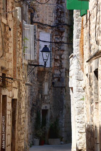Obraz na płótnie Picturesque Mediterranean street and traditional architectural details in Trogir, Croatia. w salonie
