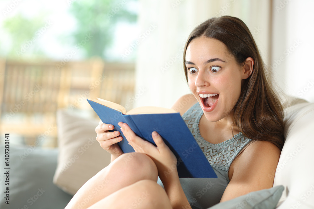 Excited woman reading paper book sitting in a house interior Excited woman reading paper book sitting in a house interior