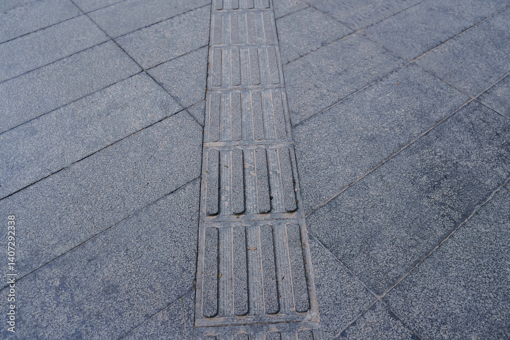 tactile paving for blind handicap on tiles pathway, walkway for blindness people located in Chengdu, China