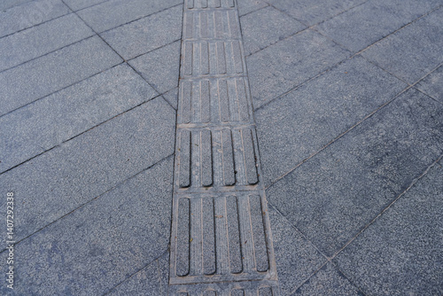 Obraz na płótnie tactile paving for blind handicap on tiles pathway, walkway for blindness people located in Chengdu, China w salonie