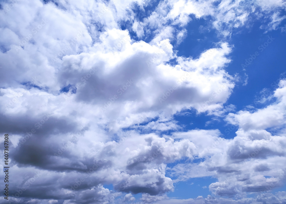 Dynamic sky with fluffy white clouds against a vibrant blue, perfect for backgrounds or conveying freedom and hope. A serene, optimistic scene. Dynamic sky with fluffy white clouds against a vibrant blue, perfect for backgrounds or conveying freedom and hope. A serene, optimistic scene.
