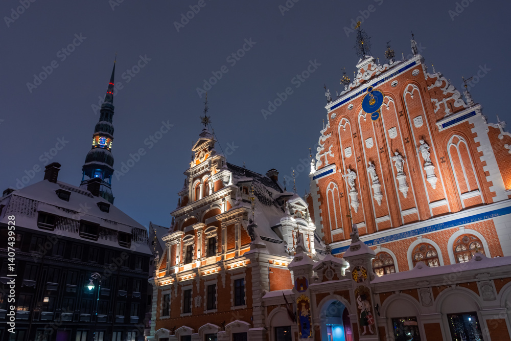 Snowy square of Riga historic center at night, Latvia