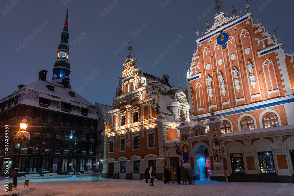 Snowy square of Riga historic center at night, Latvia