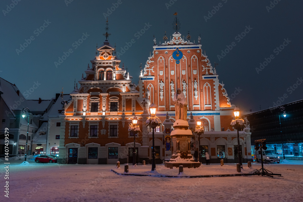 Snowy square of Riga historic center at night, Latvia