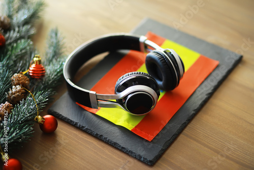 Christmas Headphones on Spanish Flag: Festive Holiday Music Background