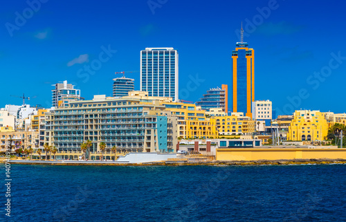 Obraz na płótnie Cityscape of Saint Julian's with modern hotel buildings and skyscrapers viewed from the Sea, Malta w salonie