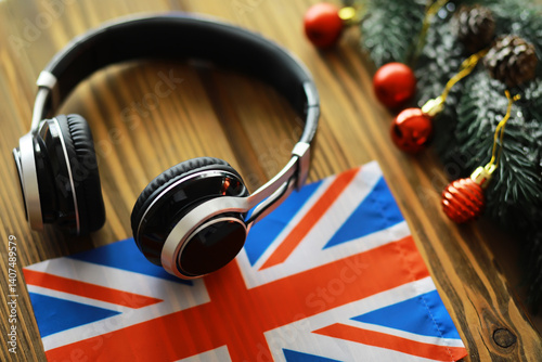 Headphones on British Flag with Christmas Decorations - Festive Music Holiday Concept