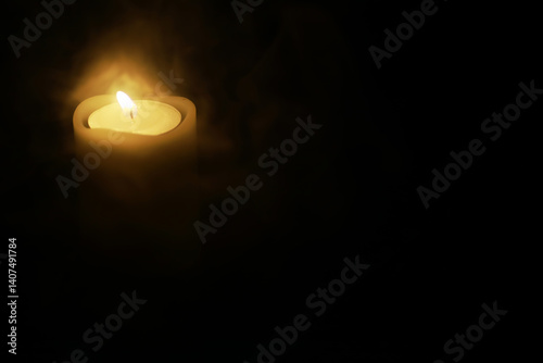 Obraz na płótnie Illuminated Candle in Darkness, Symbolizing Hope, Solitude, and Serenity w salonie