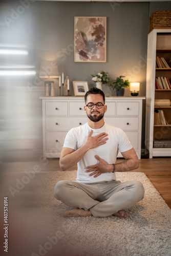 Man practicing deep breathing exercise at home for stress relief