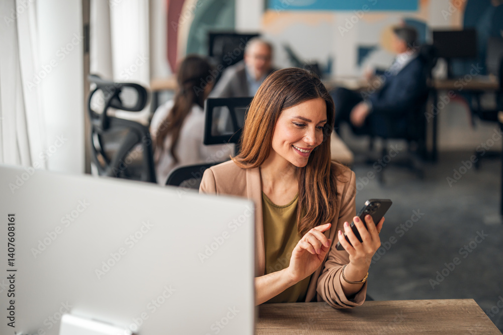 Professional Woman Checking Phone at Modern Office Workspace