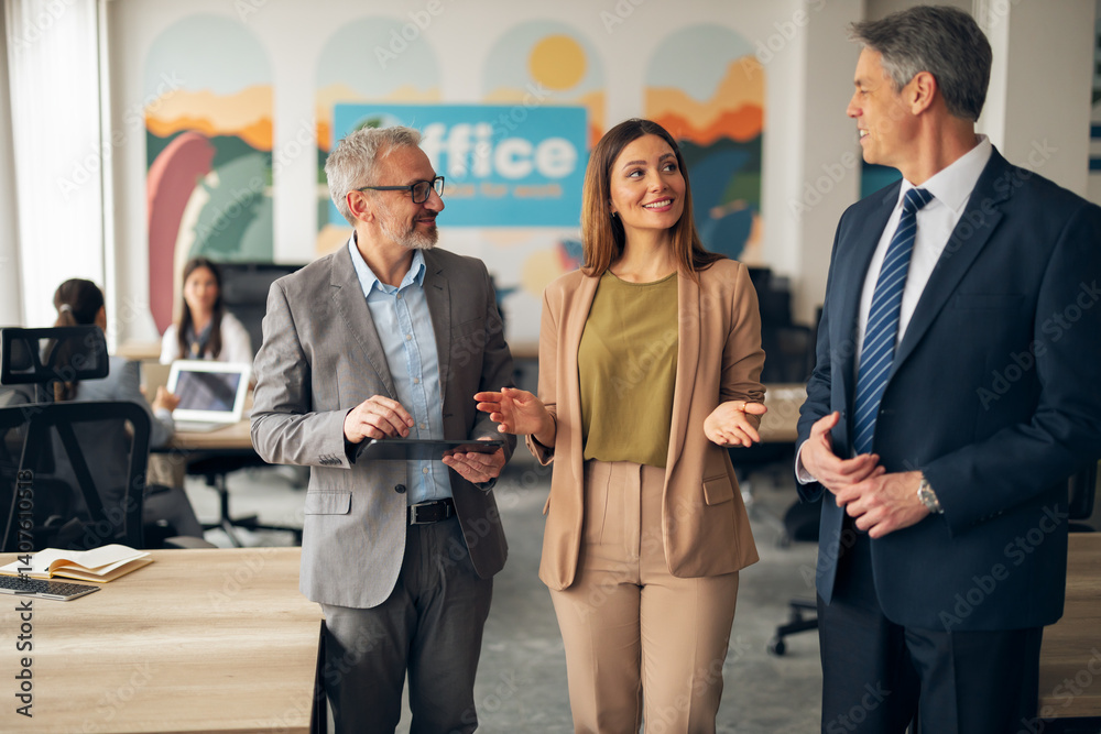Business Professionals Discussing Ideas in a Modern Office Environment