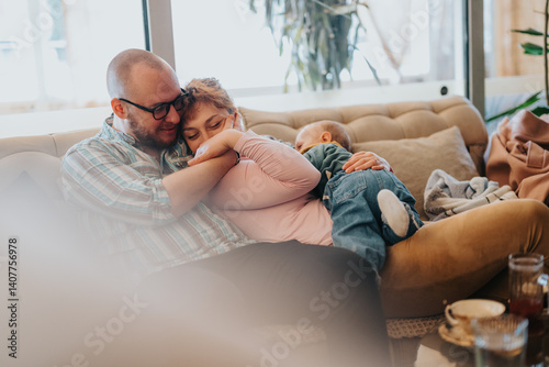 Photography A family enjoying close bonding and affection on a sofa, fostering nurturing connections at home