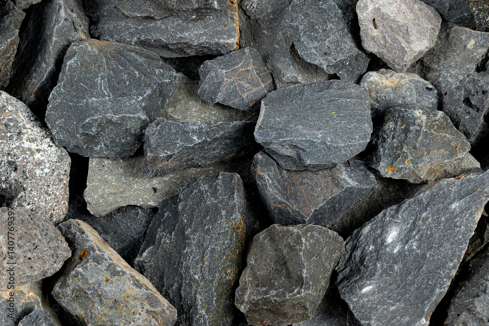 Volcanic basalt stone surface with rough texture, captured close-up Volcanic basalt stone surface with rough texture, captured close-up