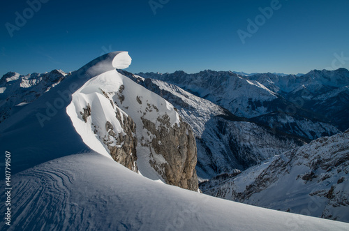 Snowbank on Alpine summit rocks
 photo
