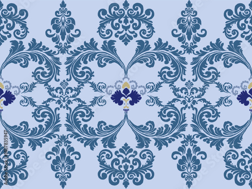 A decorative blue and purple floral pattern featuring intricate swirls and designs, ideal for textiles or wallpaper.