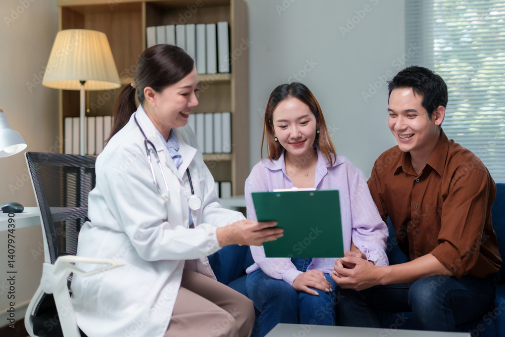 Female doctor showing diagnosis to happy young couple during medical consultation in hospital office
