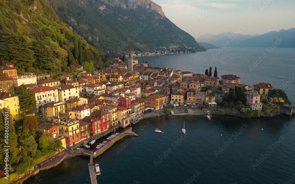 Obraz premium Panoramic aerial view of Varenna during sunset, famous picturesque old town and turistic destination in Lake Como, Lecco Province, Lombardy, Italy. Captured by drone.