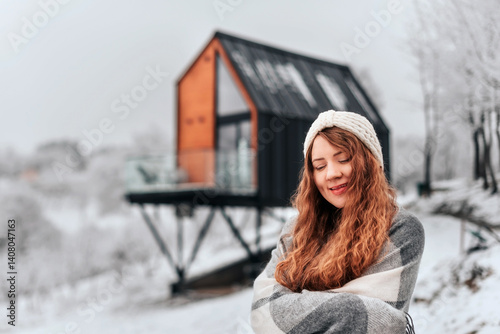 Obraz na płótnie Happy Woman Enjoying Winter Holidays in Log Cabin w salonie