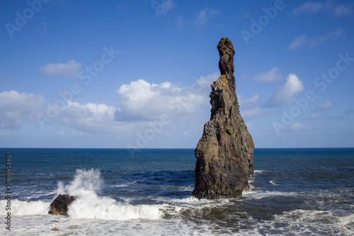 Obraz na płótnie Ilheus da Ribeira, Madeira. Dramatic rock formations rise from the sea. Coastal landscape with waves and a blue sky. w salonie