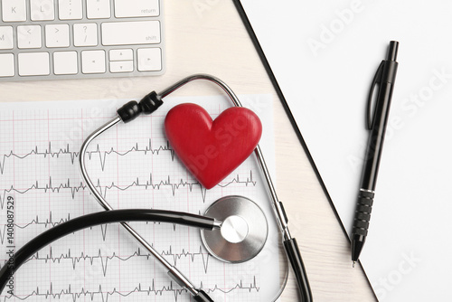 Cardiology. Flat lay composition with stethoscope, cardiogram and red decorative heart on light wooden table