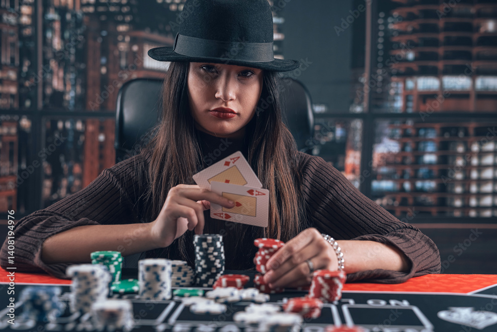 woman play poker at casino and show two ace cards and chips