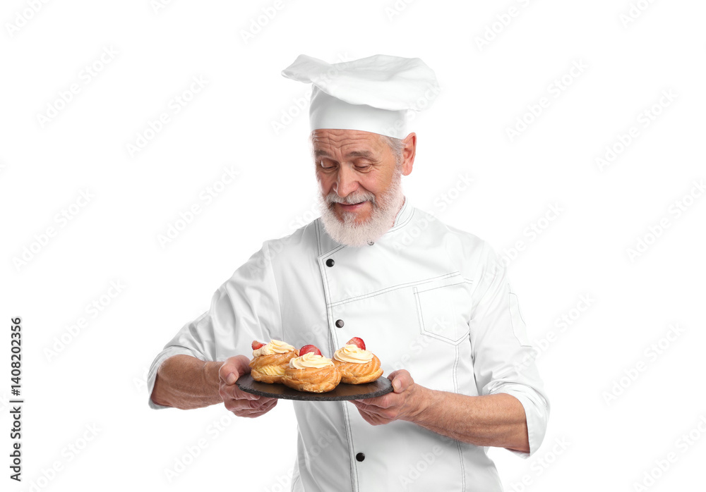 Professional pastry chef with delicious profiteroles on white background